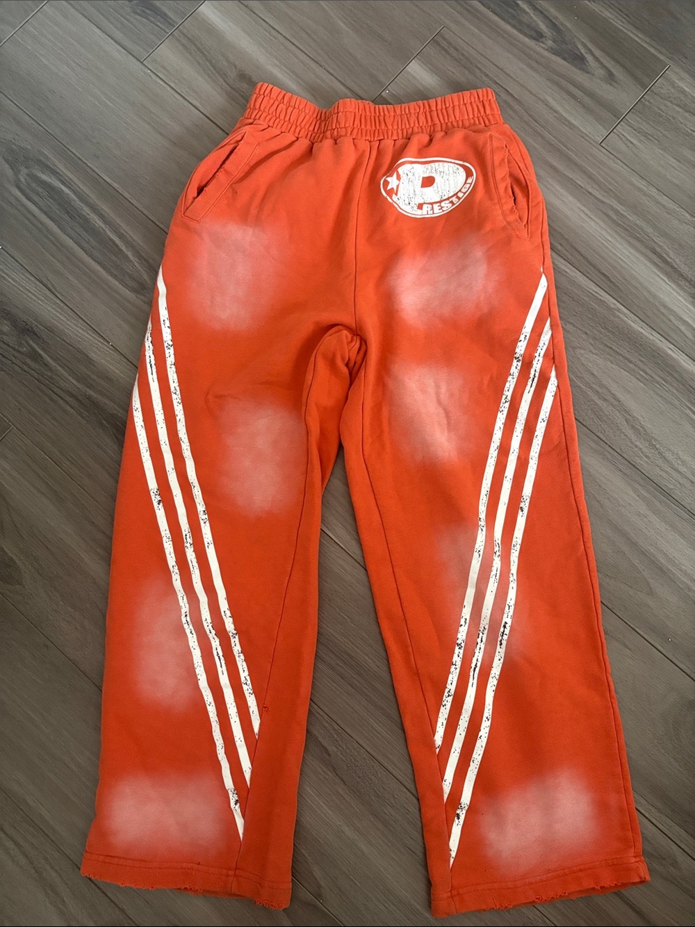 Kids Orange Joggers with White Stripe Accents